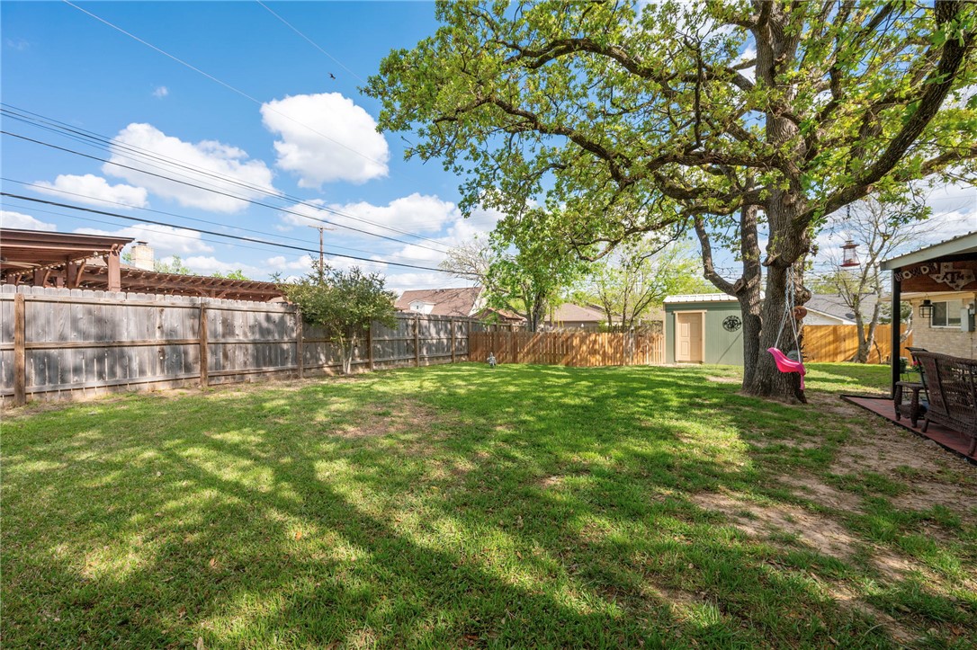 2911 Oakside Drive Bryan, TX 77802 - Photo 21 of 23 a view of a house with a backyard
