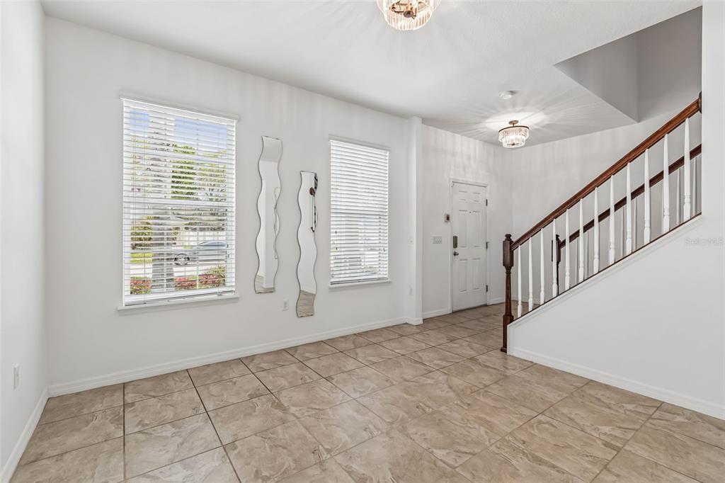 6105 Merrifield Drive Zephyrhills, FL 33541 - Photo 13 of 85 a view of an empty room with windows