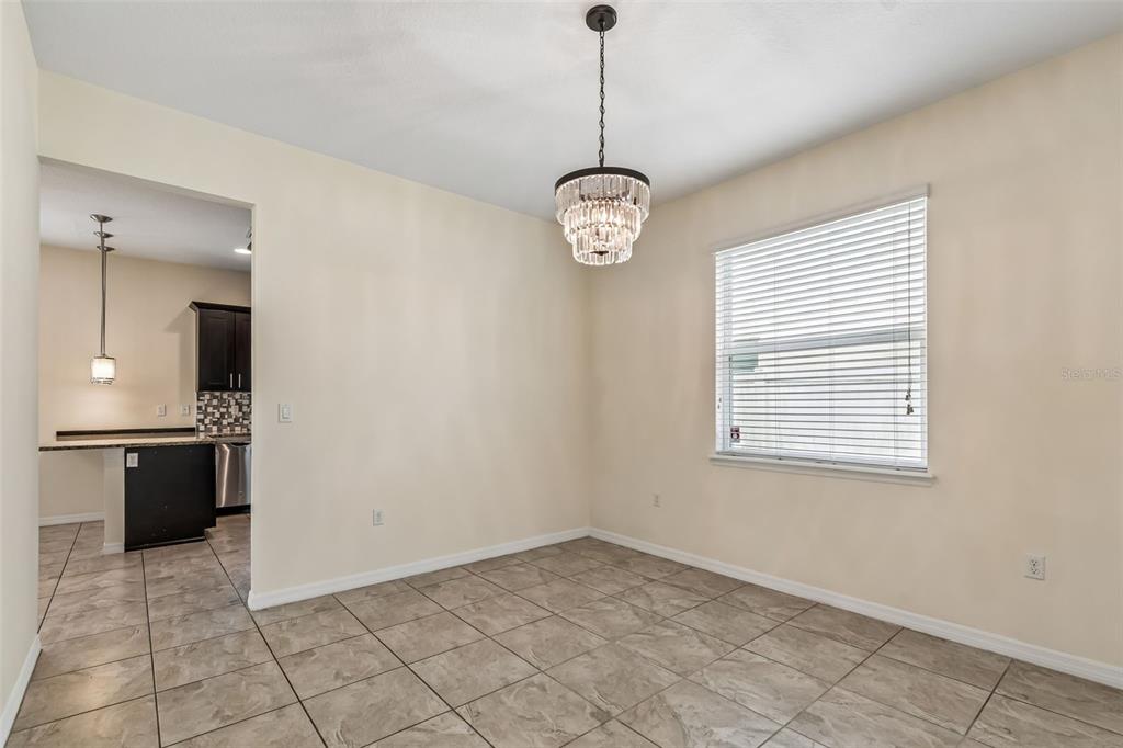 6105 Merrifield Drive Zephyrhills, FL 33541 - Photo 15 of 85 a view of an empty room with a window