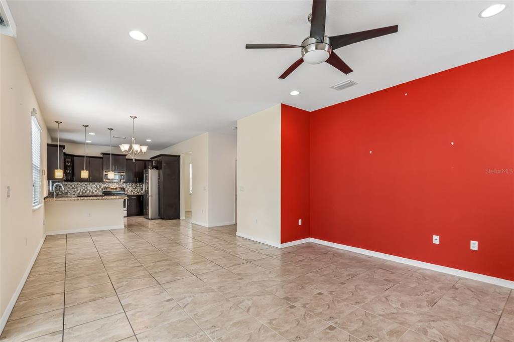 6105 Merrifield Drive Zephyrhills, FL 33541 - Photo 28 of 85 a view of a livingroom with a hall and a ceiling fan