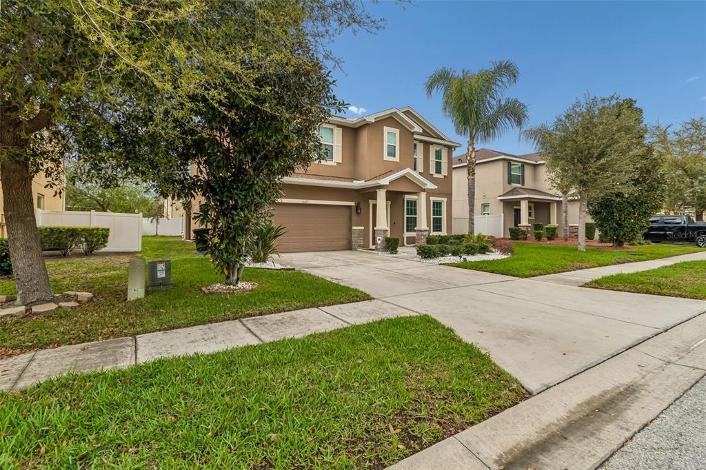 6105 Merrifield Drive Zephyrhills, FL 33541 - Photo 3 of 85 a front view of a house with a yard