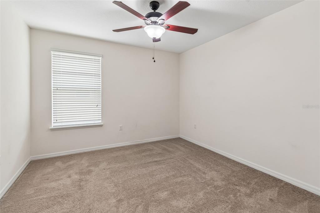 6105 Merrifield Drive Zephyrhills, FL 33541 - Photo 41 of 85 a view of an empty room with a window