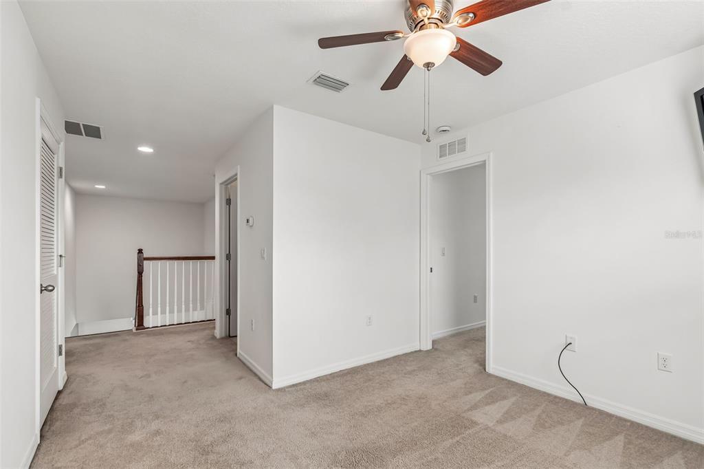6105 Merrifield Drive Zephyrhills, FL 33541 - Photo 47 of 85 a view of a chandelier fan in a room