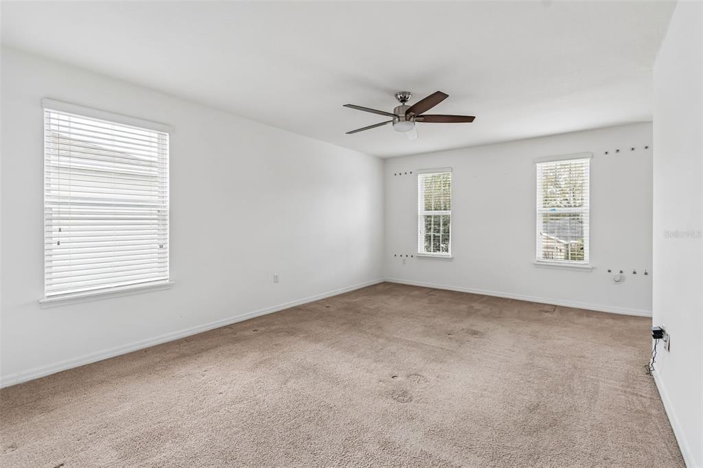 6105 Merrifield Drive Zephyrhills, FL 33541 - Photo 54 of 85 a view of an empty room with a window