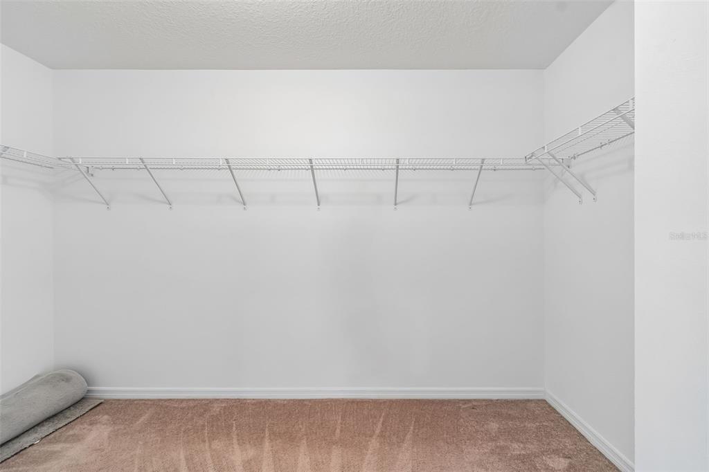 6105 Merrifield Drive Zephyrhills, FL 33541 - Photo 59 of 85 a view of a room with racks on the wall