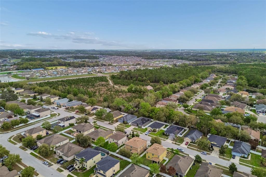 6105 Merrifield Drive Zephyrhills, FL 33541 - Photo 81 of 85 an aerial view of a city with lots of residential buildings