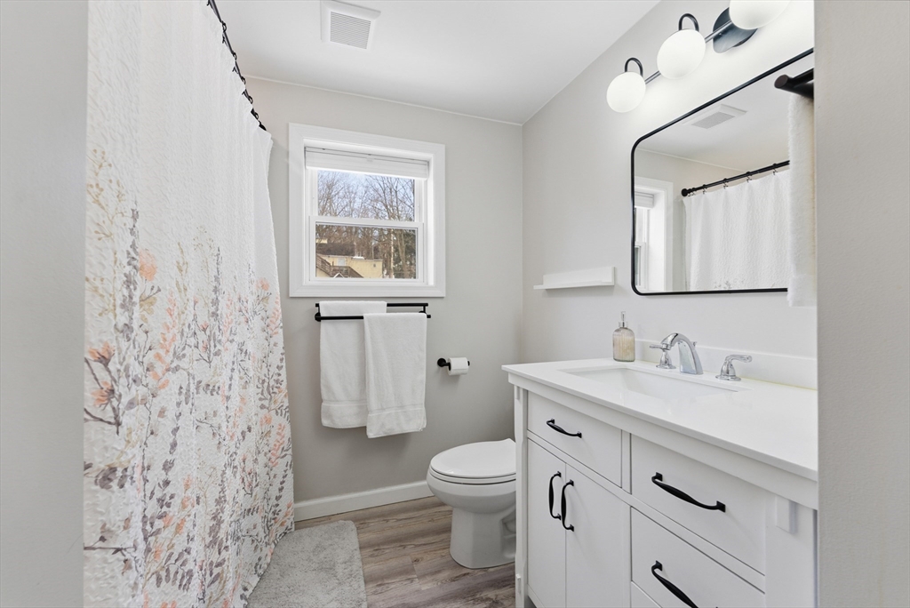 160 Cottage Street Athol, MA 01331 - Photo 21 of 35 a bathroom with a granite countertop sink toilet and shower