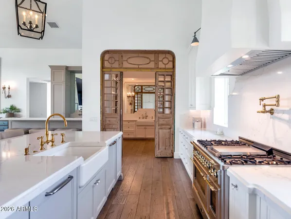 a kitchen with stainless steel appliances granite countertop a stove and a sink