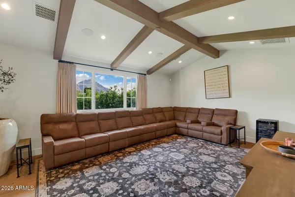 a living room with furniture and a large window