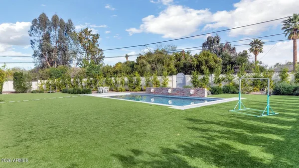 a view of a fountain in front of a house