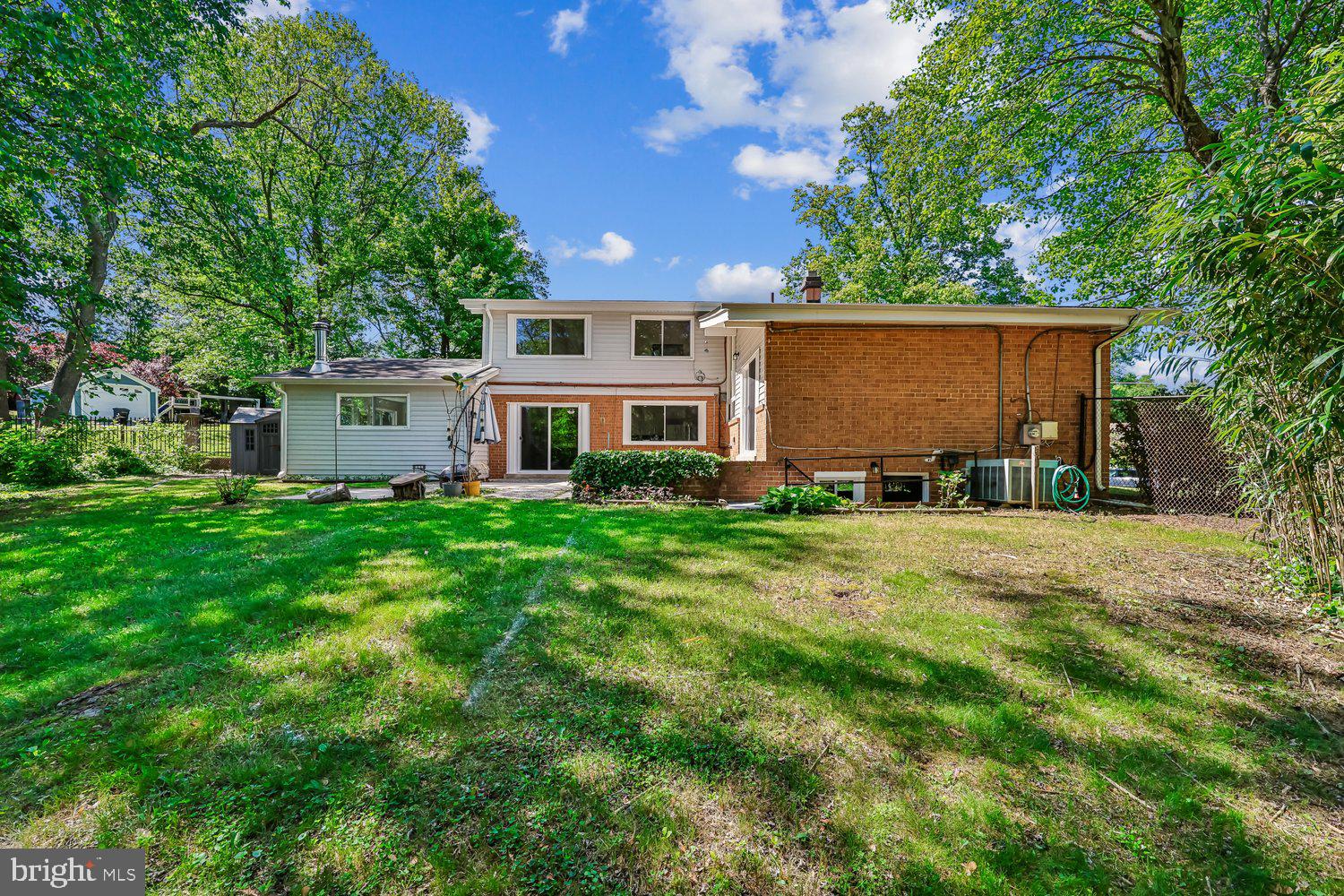 300 Gilsan Court Silver Spring, MD 20902 - Photo 19 of 117 a front view of a house with a yard and trees