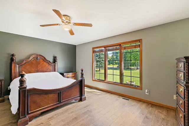 a bedroom with a bed and window