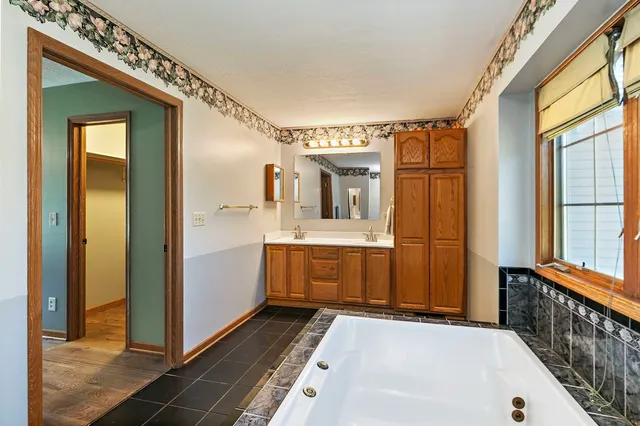 a view of a bathroom with a sink and mirror