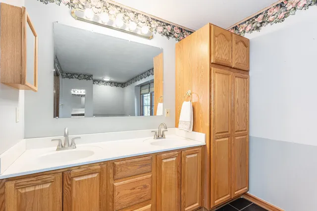 a bathroom with a sink and a mirror