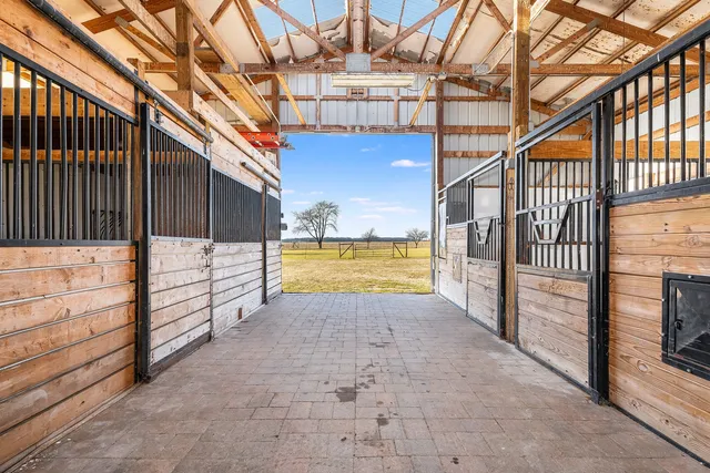 a view of a patio with table and chairs