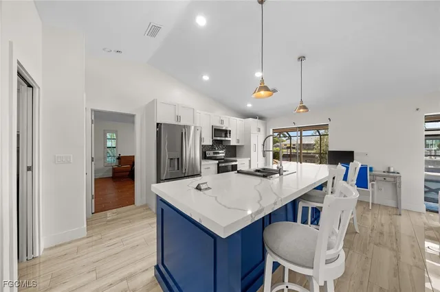 a view of kitchen and windows