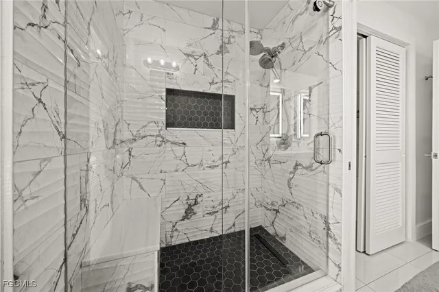 a bathroom with a shower and a sink
