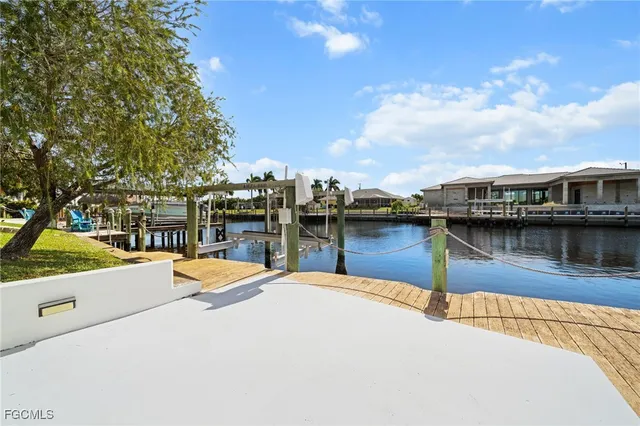a view of a lake with a house in the background