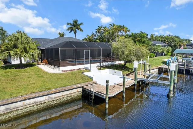 a swimming pool view with a seating space