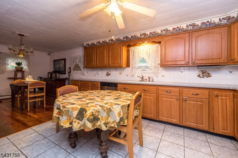 400 Mechlin Corner Road Pittstown, NJ 08867 - Photo 10 of 29 a kitchen with granite countertop a sink cabinets and window