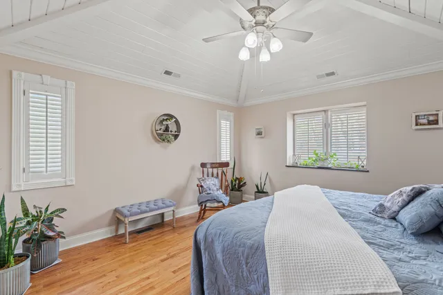 a spacious bathroom with a tub sink and mirror