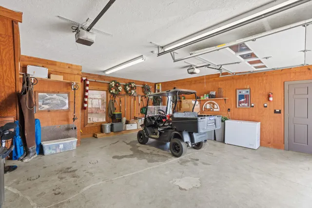 an aerial view of a houses with lake view