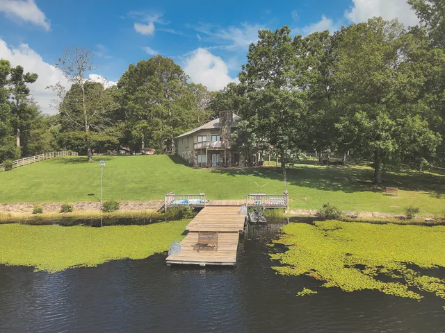 a view of a lake with a yard