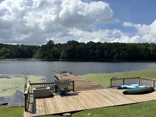 an aerial view of residential houses with outdoor space and swimming pool