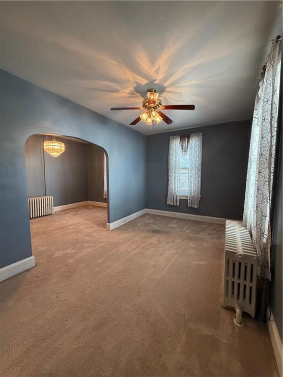 1028 Main Street Republic, PA 15475 - Photo 12 of 27 en empty room with windows and fan