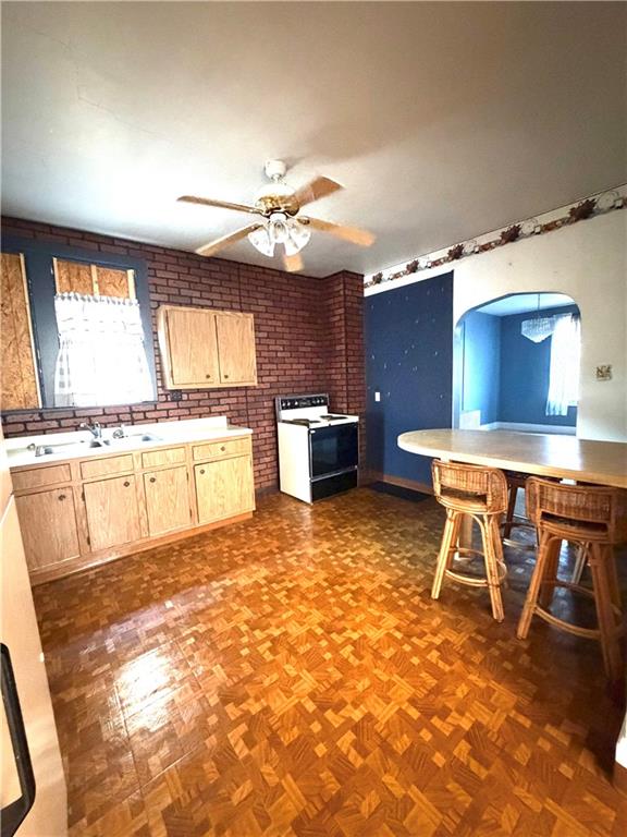 1028 Main Street Republic, PA 15475 - Photo 7 of 27 a kitchen with a stove a table and chairs in it