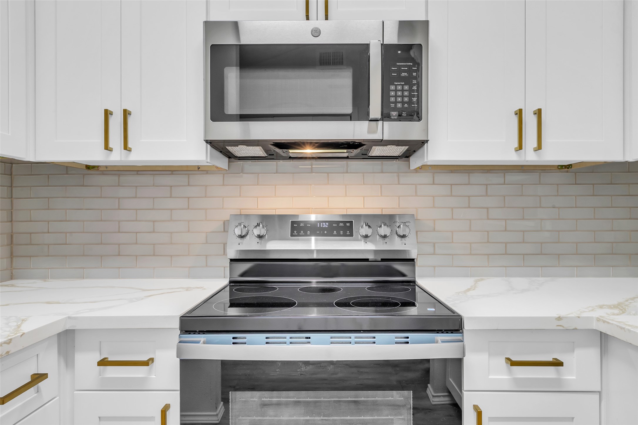 4900 Floyd Street, Unit 10 Houston, TX 77007 - Photo 17 of 30 a stove top oven sitting inside of a kitchen