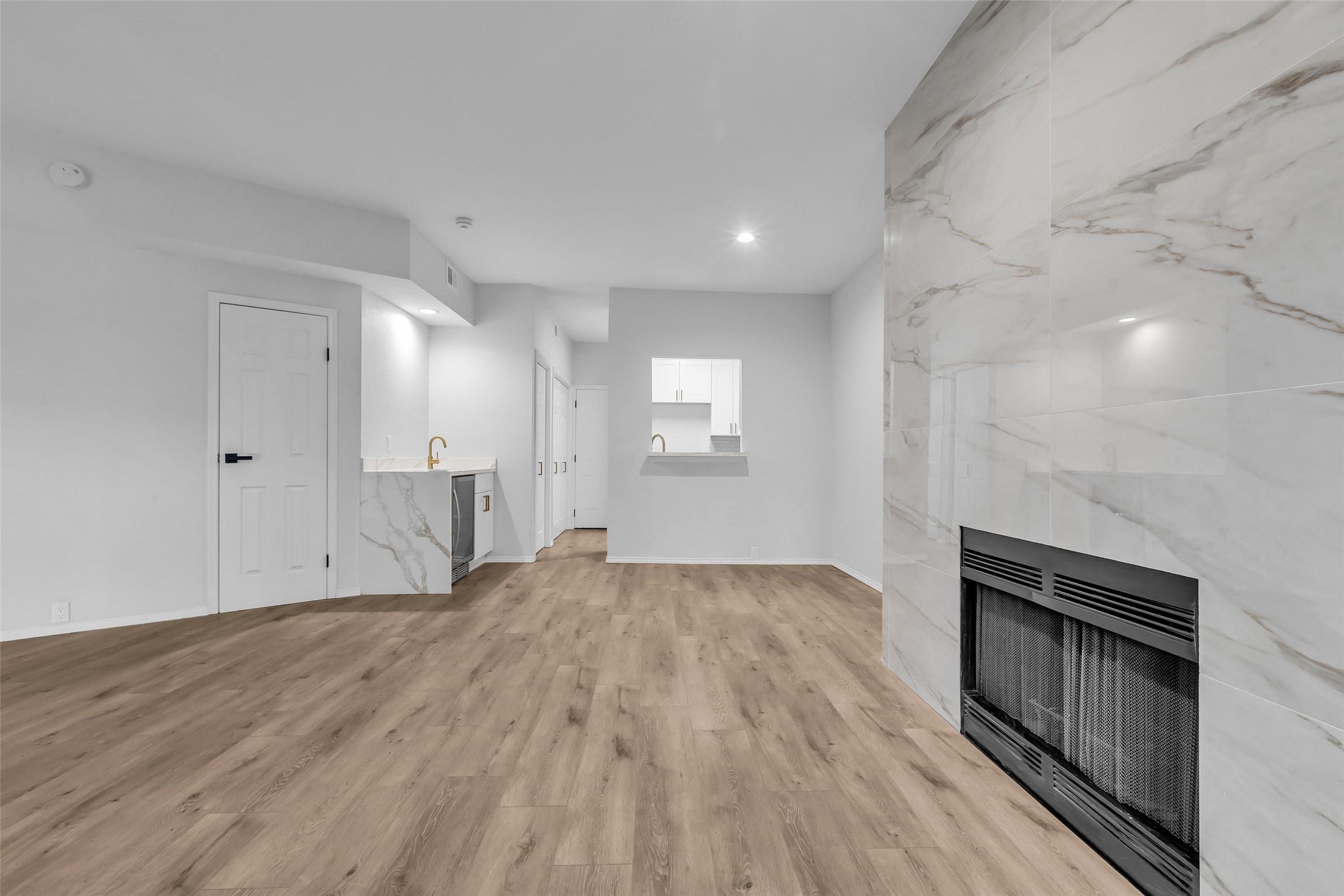 4900 Floyd Street, Unit 10 Houston, TX 77007 - Photo 2 of 30 a view of empty room with wooden floor and fan