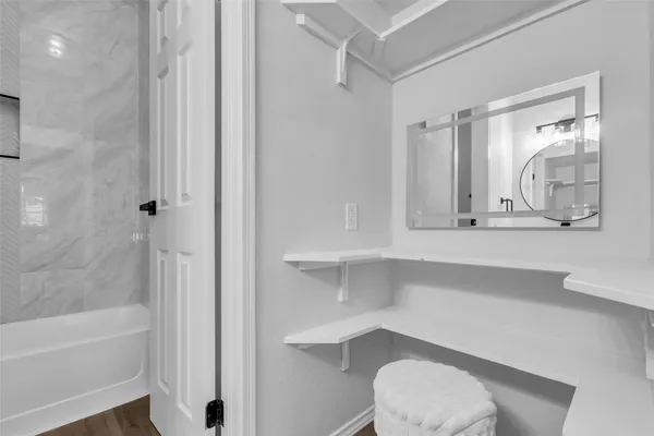 a bathroom with a toilet a sink and bathtub