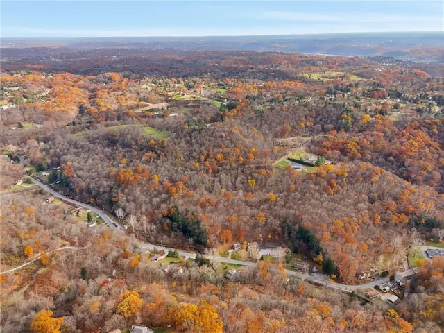 an aerial view of residential house and green space
