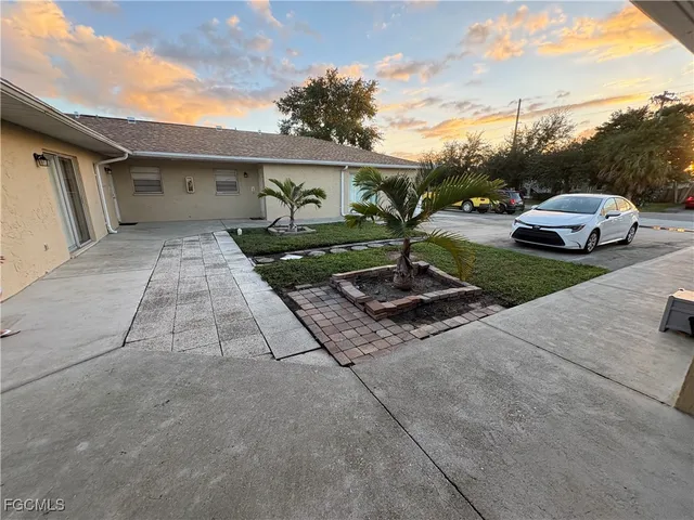 a view of a car parked in front of a house