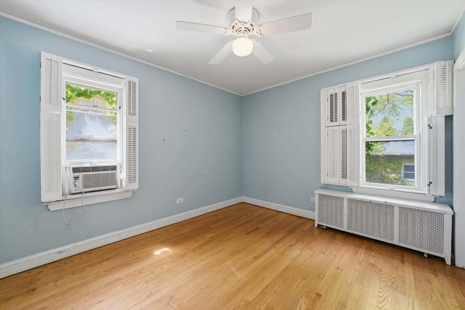 3100 Clinton Avenue Berwyn, IL 60402 - Photo 13 of 25 a view of an empty room with wooden floor and a window