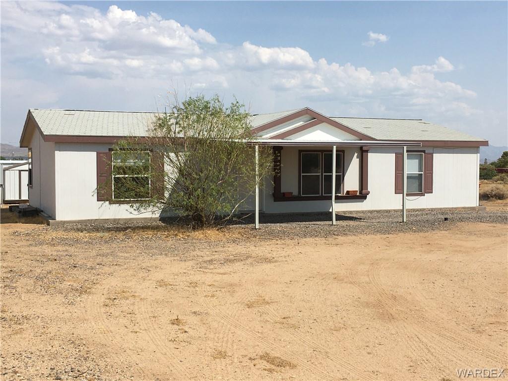 3690 Gila Road Golden Valley, AZ 86413 - Photo 1 of 1 a front view of a house with garden