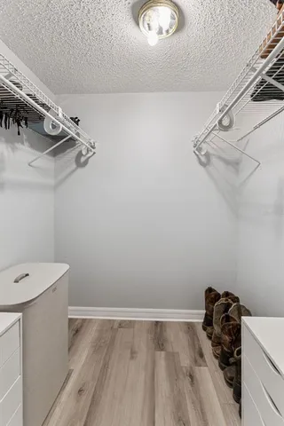 a room with cabinets and wooden floor