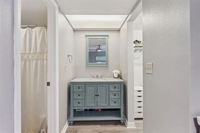 a bathroom with a double vanity sink and mirror