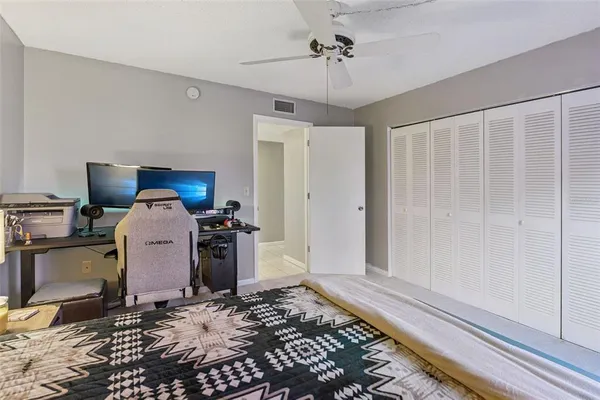 a view of a kitchen with refrigerator and workspace