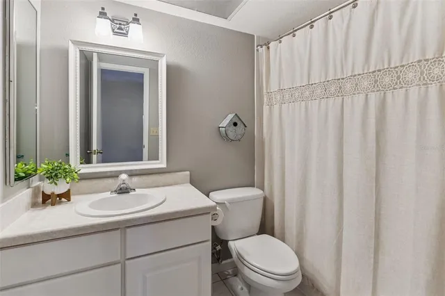 a bathroom with a sink a mirror and a toilet