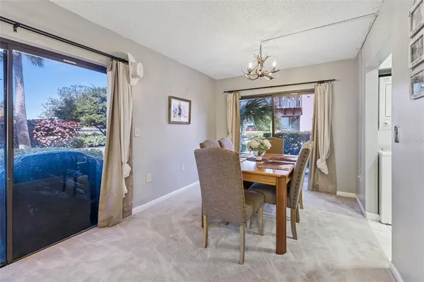a view of a dining room with furniture window and outside view