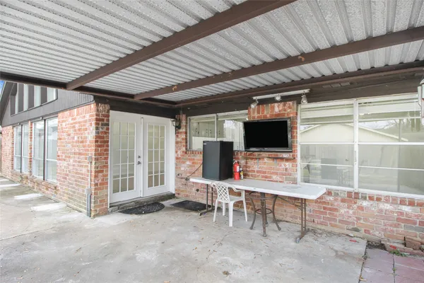a room with furniture and flat screen tv
