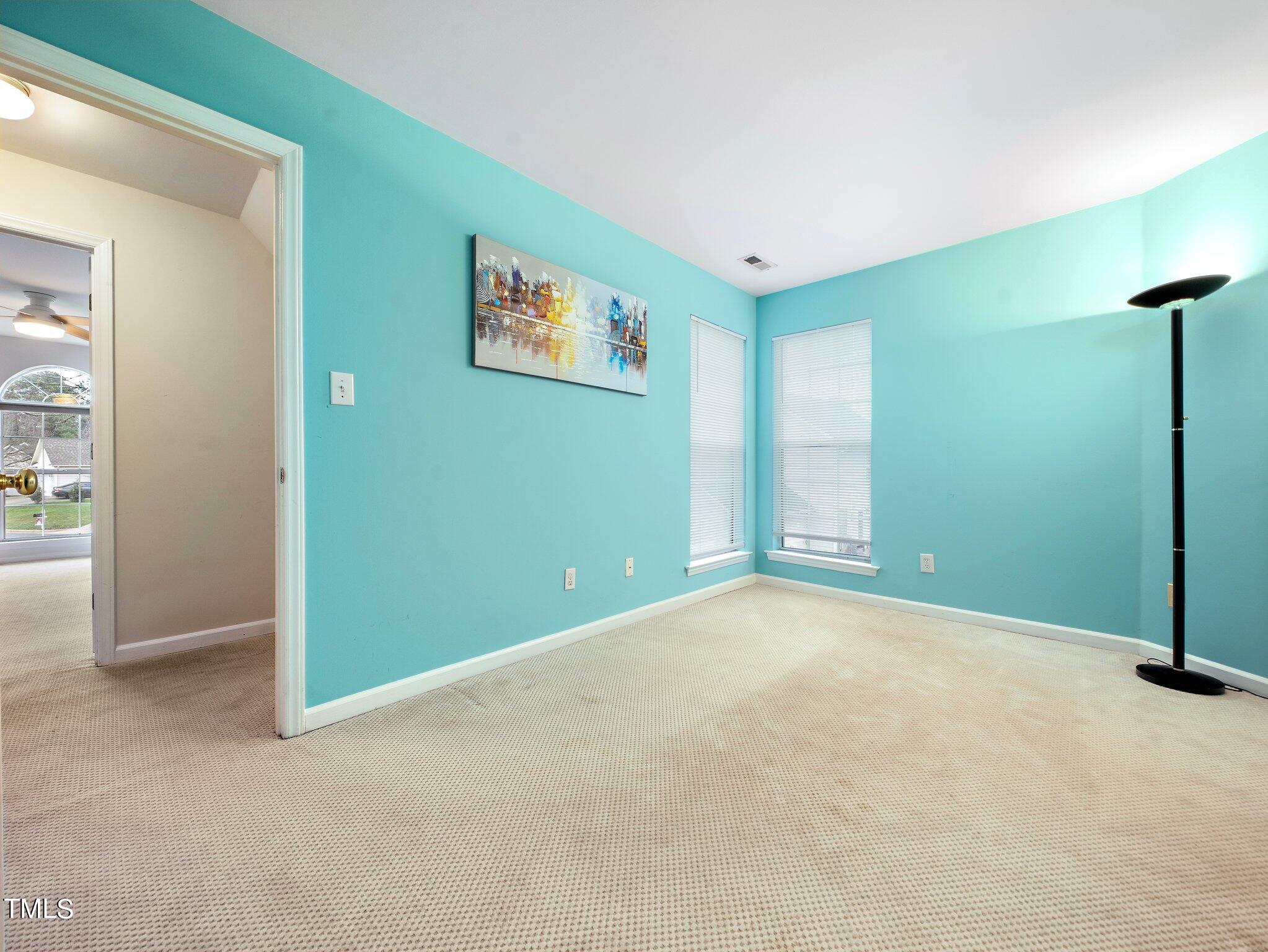 112 Riva Trace Drive Cary, NC 27513 - Photo 20 of 29 an empty room with windows