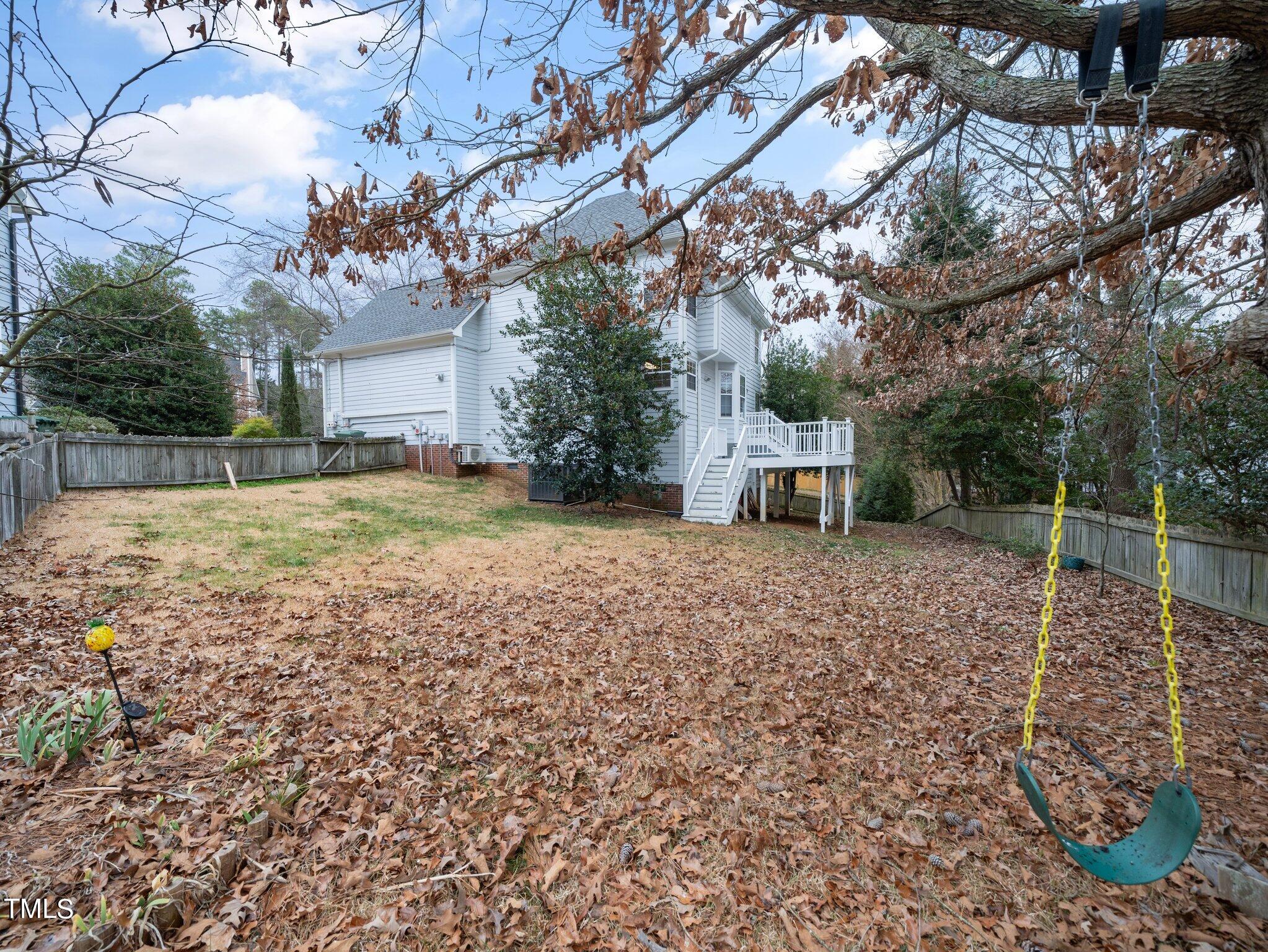 112 Riva Trace Drive Cary, NC 27513 - Photo 23 of 29 a backyard of a house with a table and chairs