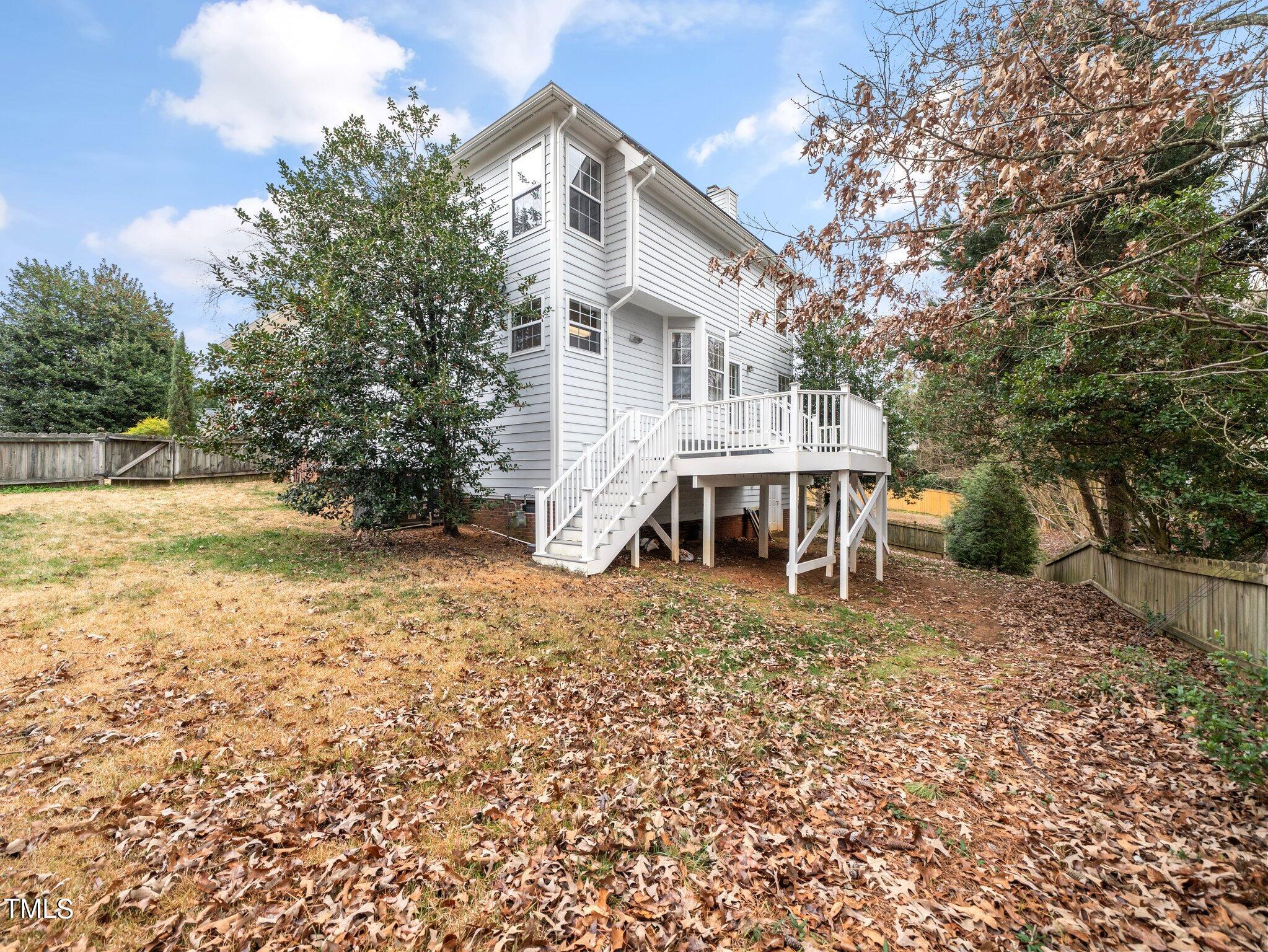112 Riva Trace Drive Cary, NC 27513 - Photo 24 of 29 a white house that has a tree in front of it