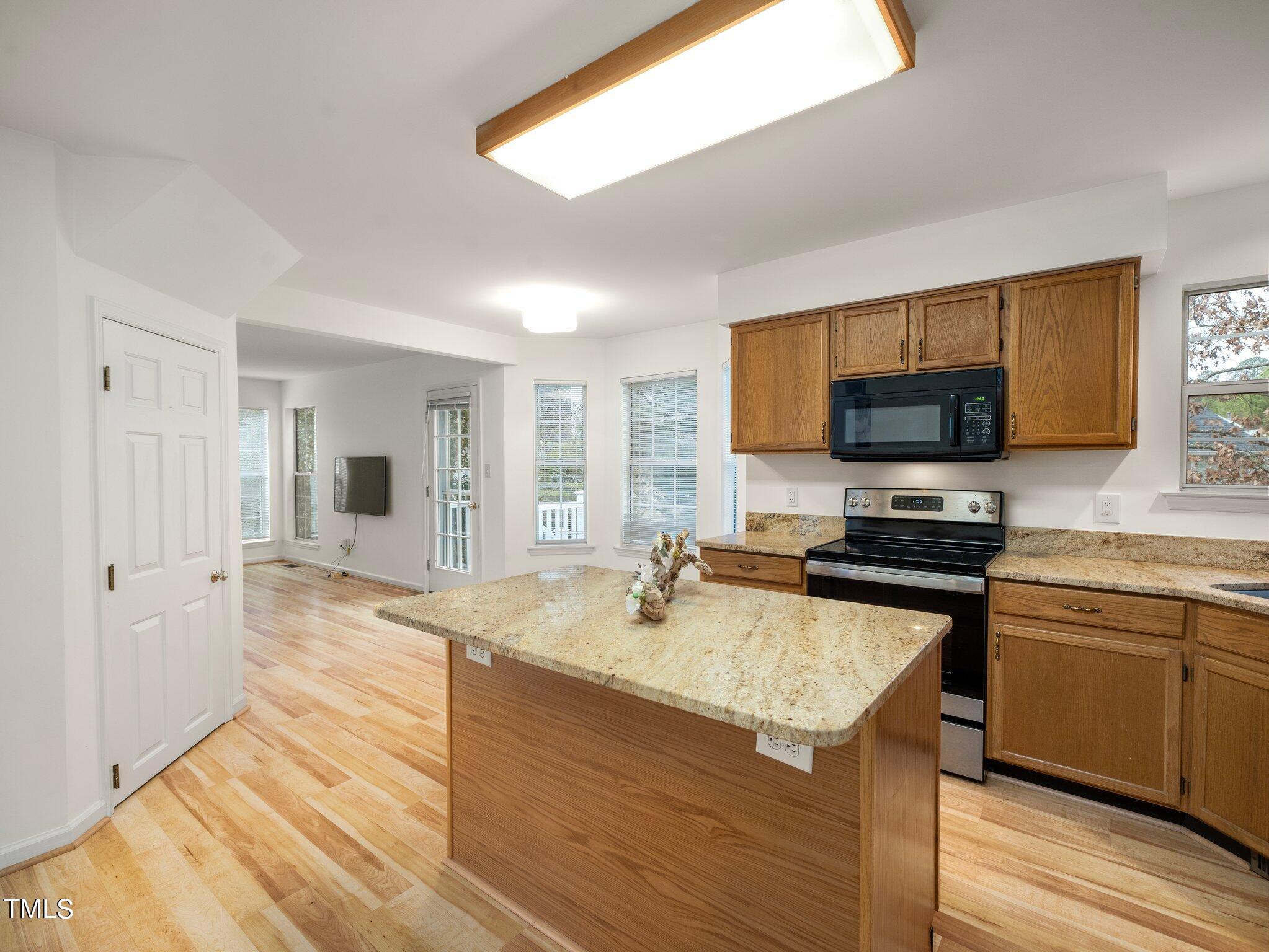 112 Riva Trace Drive Cary, NC 27513 - Photo 10 of 29 a kitchen with a sink stove and refrigerator