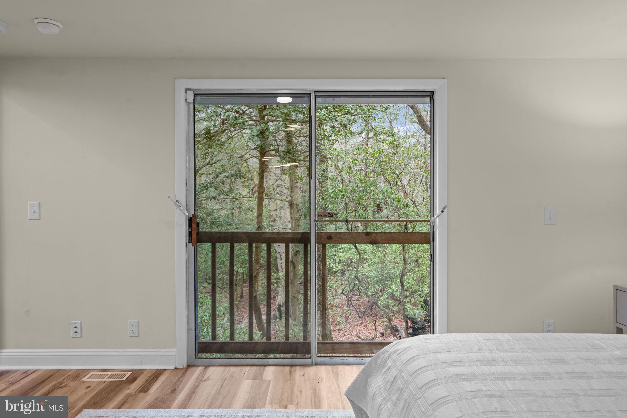 11492 Rawhide Road Lusby, MD 20657 - Photo 27 of 96 a bed sitting in a bedroom next to a window