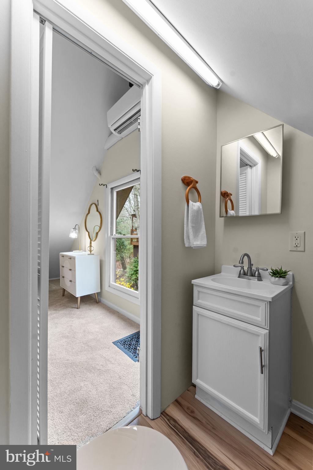 11492 Rawhide Road Lusby, MD 20657 - Photo 37 of 96 a en suite bathroom with a toilet sink and mirror