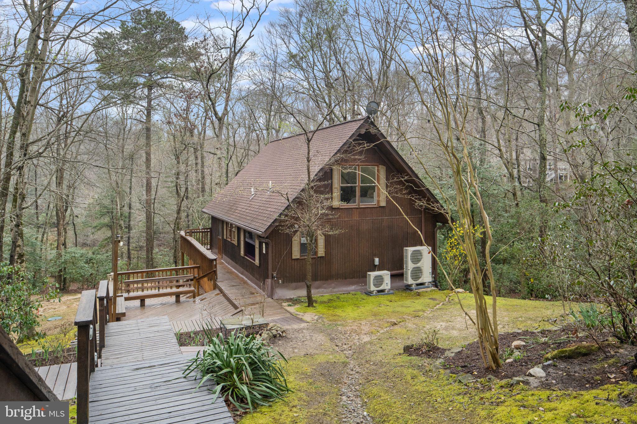 11492 Rawhide Road Lusby, MD 20657 - Photo 4 of 96 a front view of a house with a yard